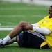 Milton Carhtens grimaces in pain after hurting his knee during the Victors Classic alumni football game at Michigan Stadium on Saturday. Melanie Maxwell I AnnArbor.com